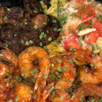 The Big 3 Aka Belly Buss · Slow Braised Oxtail ,Jerk chicken  & Jumbo Shrimp served over  mac & cheese or Rasta Pasta o...