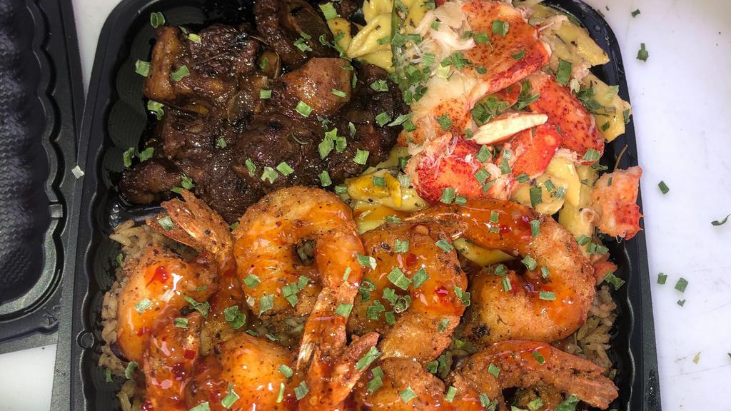 The Big 3 Aka Belly Buss · Slow Braised Oxtail ,Jerk chicken  & Jumbo Shrimp served over  mac & cheese or Rasta Pasta or Rice & Peas with steam cabbage .