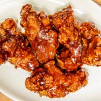 Spicy Bbq Wings · Hand tossed in savoury deep blend of barbecue flavours with a kick of spice. Served with cel...