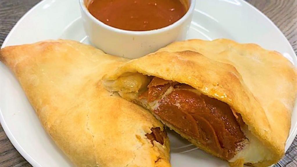 Pepperoni Calzone · Our pizza dough stuffed with fresh pepperoni,  and mozzarella, parmesan, and ricotta cheese