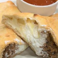 Sausage Calzone · Our pizza dough stuffed with fresh sausage, mozzarella, parmesan, and ricotta cheese