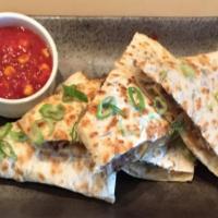 Crunchy Bulgogi Quesadilla · Korean style marinated beef, colby jack, tortilla strips, stir-fried vegetables grilled in a...