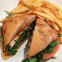 Grilled Chicken Sandwich · Grilled chicken breast, arugula, tomatoes and mozzarella cheese with homemade pesto sauce an...