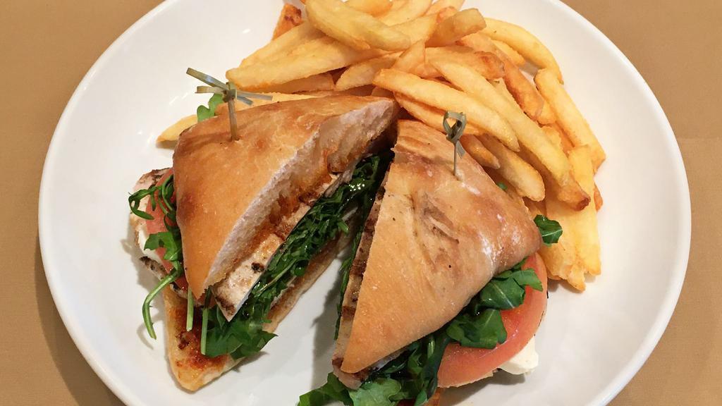 Grilled Chicken Sandwich · Grilled chicken breast, arugula, tomatoes and mozzarella cheese with homemade pesto sauce and balsamic glaze.