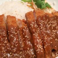 Donkatsu With Rice · Panko crusted pork cutlet with gravy sauce.