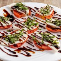 Caprese Salad · Vegetarian. Tomatoes, fresh mozzarella, and basil with balsamic vinaigrette