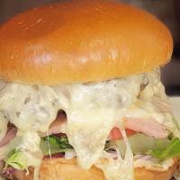 Beef Cordon Bleu Burger · Handcrafted beef patty, Swiss cheese, ham, homemade mushroom sauce, raw onion, lettuce and t...