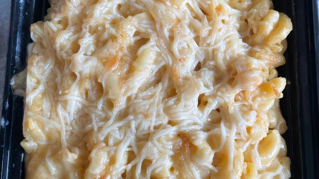 Truffle Mac & Cheese Pasta · Macaroni with truffle oil in a creamy parmesan, cheddar, and Fontina Cheese.