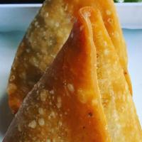 Samosa · Crisp parcels of seasoned potatoes and peas with mint-tamarind chutney.