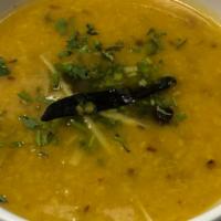 Dal Tadka · Yellow lentils tempered with light spices and finished with clarified butter.
