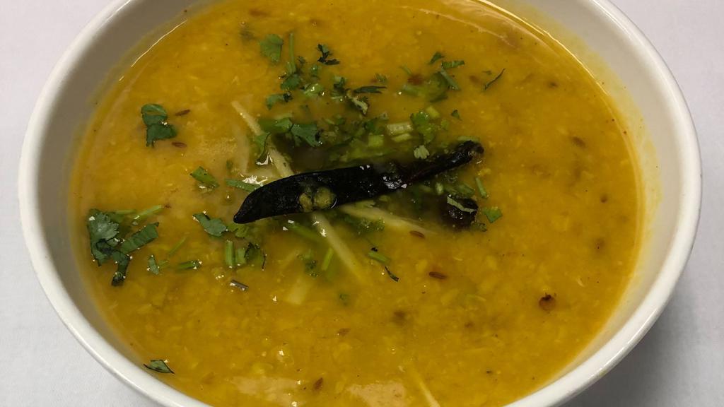 Dal Tadka · Yellow lentils tempered with light spices and finished with clarified butter.