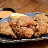 Kara-Age Fried Chicken · Japanese-style juicy fried dark meat chicken, lemon slice, homemade spicy mayo.