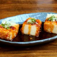 Tofu Fire · Light batter-fried tofu, sweet n’ hot chili sauce, topped with scallions.