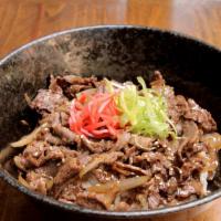 Yakiniku Don · Tender slices of beef sautéed with onions in a savory Japanese barbeque sauce, topped with s...