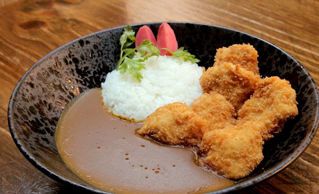 Katsu Curry · Panko-breaded deep fried white meat chicken or pork cutlet served with an all-vegetable broth savory curry.