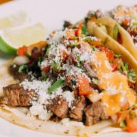 Steak Street Tacos · Cheese, guacamole, pico de gallo, cilantro, chipotle aioli, soft corn tortilla