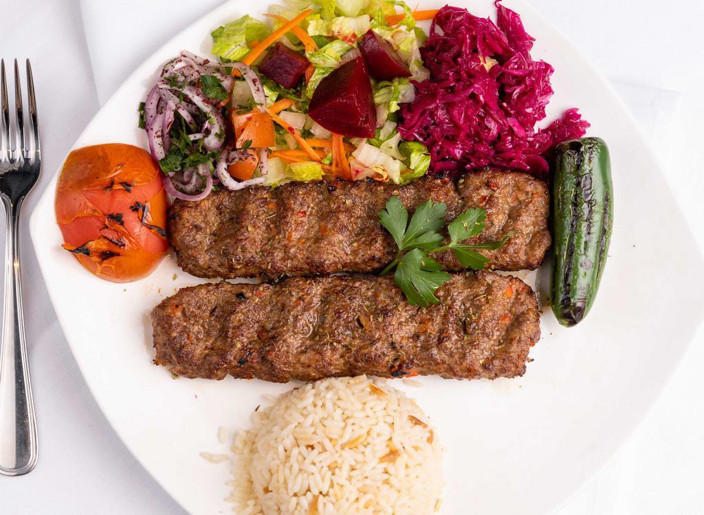 Lamb Adana Kebab · Hand chopped lamb, seasoned with Turkish spices and served with rice, onion, and vegetables.