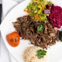 Doner Kebab · Turkish gyro. Ground lamb and beef cooked on a rotating spin then thinly sliced, served with...