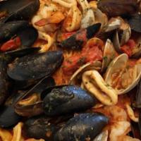 Seafood Combo · (Red or White). Jumbo shrimp, clams, mussels & calamari over linguini.