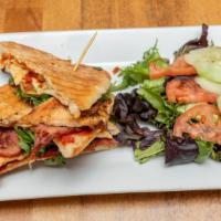 Tuscan Club Panini · Turkey bacon, melted mozzarella cheese, roasted tomato pesto and shaved red onions on whole ...