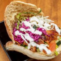 Doner Chicken Pita · Authentic German style doner kebab served with fresh mix salad and topped with choice of sau...