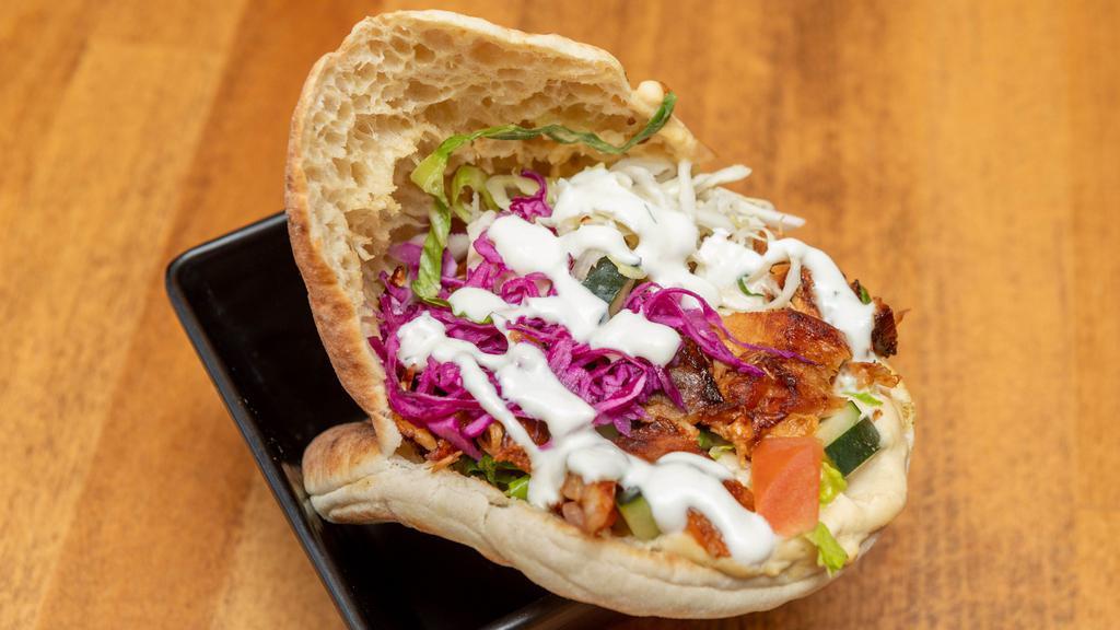 Doner Chicken Pita · Authentic German style doner kebab served with fresh mix salad and topped with choice of sauce.