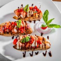 Bruschetta · Fresh mozzarella, red and white onion and garden fresh tomatoes marinated in a balsamic dres...