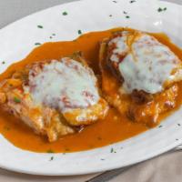Veal Sorrentino · Sautéed veal layered with eggplant, prosciutto and mozzarella in a marsala wine sauce.