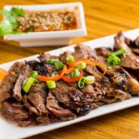 Sua Rong Hai · Grill marinated shell steak w/ spicy tamarind lime dipping sauce.