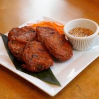 Thai Fish Cake · Curry fish cake made with fish blend with curry paste, long bean and kaffir lime leaves serv...