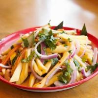 Yum Mamuang · Mango, red onion, cilantro, avocado tossed w/ house spicy dressing topped w/ dry crispy anch...