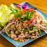 Laab Moo · Minced pork w/ ground toasted rice, coriander, red onion and mint leaves; seasoned w/ chili ...
