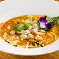 Coconut Crab Curry · Issan traditional red curry dish w/ lump crab meat.