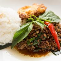 Wok Basil · Ground pork or beef strips stir fried w/ Thai basil, fresh bird eye chili, onion and garlic ...