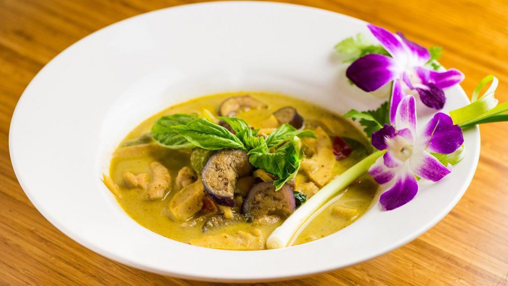 Green Curry · Bell peppers, Thai eggplant, bamboo shoot, string bean, basil leaves in green curry sauce, served w/ white rice.