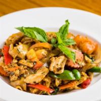 Pad Kee Mow · Sauteed rice noodles w/ egg, onion, tomatoes, hot pepper, basil leaves in chilly basil sauce.