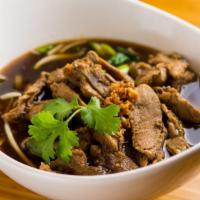 Kwei Thew Ped · Rice noodle in five spice soy broth served w/ roasted duck.