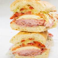 Spicy Italian Combo · Pepper Ham, Genoa Salami, Hot Capicola and Provolone Cheese. Topped with Lett, Tom, Red Onio...