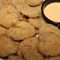 Fried Pickles · Super addictive! Lightly fried pickle slices served with our signature cyclone sauce for dip...