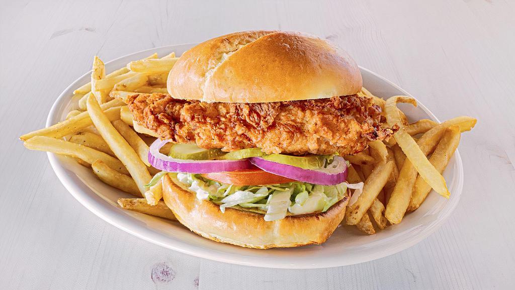 Buttermilk Crispy Chicken Sandwich · Buttermilk soaked, hand-breaded chicken breast is fried to perfection, topped with lettuce, tomato, red onions, pickles and mayo on a toasted brioche bun. Served with a side item (1110-1380 cal.)