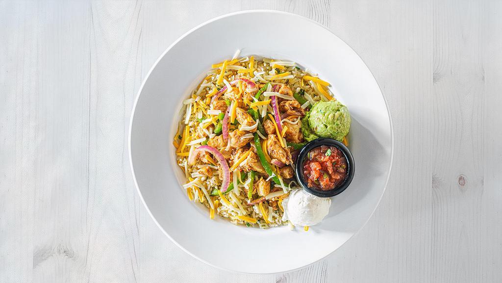 Fajita Rice Bowl · Mesquite grilled chicken, cheddar jack cheese, grilled peppers and onions over cilantro lime rice. Served with guacamole, sour cream and salsa. (910 cal.)