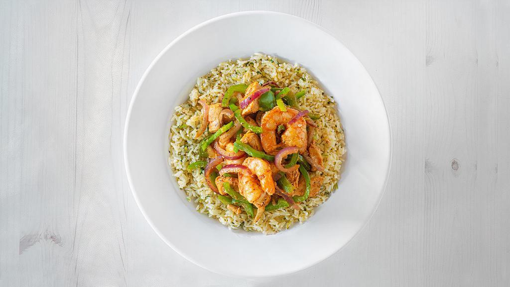 Calypso Seafood Bowl · This goddess bowl features cajun seasoned shrimp and mahi mahi sauteed with onions and peppers in a ginger sauce. Served on a bed of cilantro lime rice. (960 cal.)