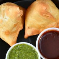 Potato-Peas Samosa (2Pc, Vegan)) · call' em Indian empanadas, served with mint yogurt sauce