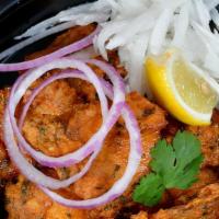 Fish 'Amritsari' With Mooli Lacha · crunchy spiced fish in gluten free batter and radish slaw