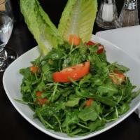 Arugula Salad · Favorite. Fresh arugula, tomatoes and red pepper. Served with house dressing.