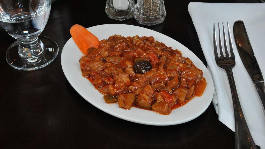 Eggplant With Sauce · Eggplant and sautéed fresh tomatoes and peppers.