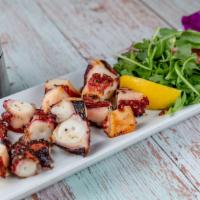Octopus Salad · Char-grilled octopus legs served with mixed greens.