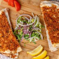  Lahmacun · Three pieces of thin crust dough topped with minced meat.