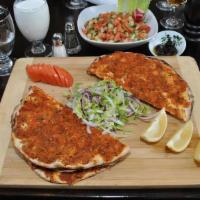 Vegetarian Lahmacun · Three pieces of thin crust dough topped with chopped vegetables and walnuts.