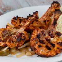  Chicken Chops · Char-grilled three pieces of chicken thighs. Served with rice pilaf and garnish.